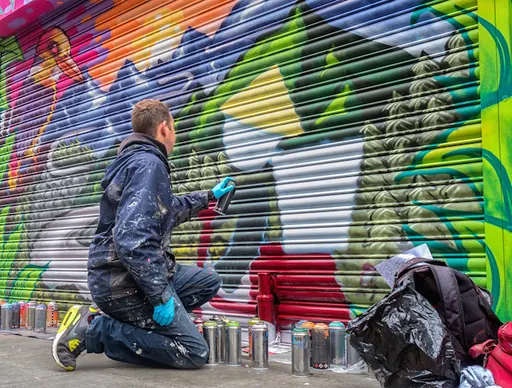 Aero painting a mural